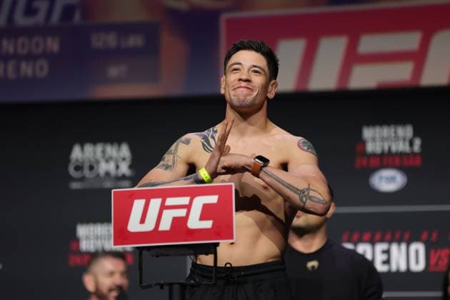 February 23, 2024, Mexico City, Ciudad de Mexico, Mexico: February 23, 2024, Mexico City, Mexico: Brandon Moreno of Mexico poses on the scale during the UFC Fight Night ceremonial weigh-in at CDMX Arena. on February 23, 2024 in Mexico City, Mexico. Mexico City Mexico - ZUMAe321 20240223_zsa_e321_138 Copyright: xLuisxMarin xEyepixxGroupx