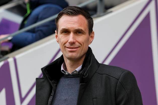 Sportdirektor Marcus Mann (Hannover 96) lacht, 2. Bundesliga, VfL Osnabrueck vs Hannover 96, Bremer Bruecke, 24.02.2024, Osnabrueck, Deutschland.