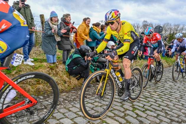 Omloop Het Nieuwsblad 2024 Cycling Race Ninove, Belgium - February 24 : Van Aert Wout (BEL) of Team Visma Lease a Bike De Lie Arnaud (BEL) of Lotto Dstny in action during the Men Elite UCI World Tour 79th Flanders Classics Omloop Het Nieuwsblad cycling race with start in Ghent and finish in Ninove on February 24, 2024 in Ninove, Belgium, 24 02 2024 ( Motordriver Kenny Verfaillie - Ninove Belgium  Copyright: xVincentxKalutx
