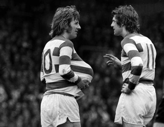 Football - 1975 1976 Queens Park Rangers v Manchester City 27 03 1976 Stan Bowles of QPR hides the ball up his shirt as he talks to Don Givens at Loftus road 