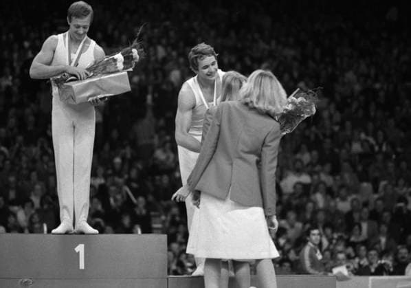 October 23-29, 1978. Strasbourg, France. Soviet gymnasts: absolute world champion Nikolai Andrianov and bronze medalist Alexander Dityatin (L-R) stand on the podium during the awarding ceremony at the 19th Artistic Gymnastics World Championships. The exact date of the photograph is unknown. Igor Utkin TASS  17612410