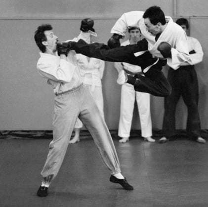 March 1-6, 1990. Moscow, USSR. Employees of the financial autonomy cash-in-transit association of the USSR State Bank Sergei Shuk and Ernst Glukhov (L-R front) practice karate at a gym. The exact date of the photograph is unknown. Alexander Yakovlev TASS  18396815