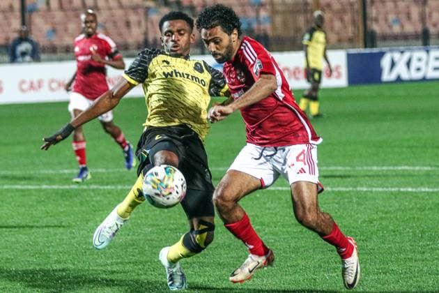 (240302) -- CAIRO, March 2, 2024 -- Hussein Aly Hassan (R) of Al Ahly competes during the CAF Champions League Group D football match between Al Ahly of Egypt and Young Africans of Tanzania in Cairo, Egypt, March 1, 2024. ) (SP)EGYPT-CAIRO-FOOTBALL-CAF CHAMPIONS LEAGUE AhmedxGomaa 