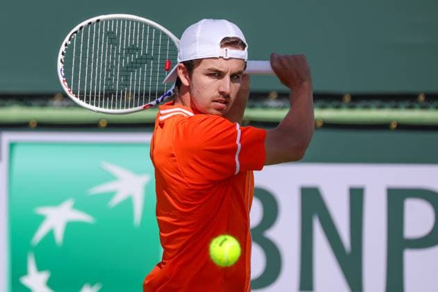 INDIAN WELLS, CA - MARCH 05: Zachary Svajda (USA) hits a backhand during the qualifying round for the BNP Paribas Open on March 5, 2024 at Indian Wells Tennis Garden in Indian Wells. CA. (Photo by George Walker Icon Sportswire) TENNIS: MAR 05 BNP Paribas Open EDITORIAL USE ONLY Icon240305001