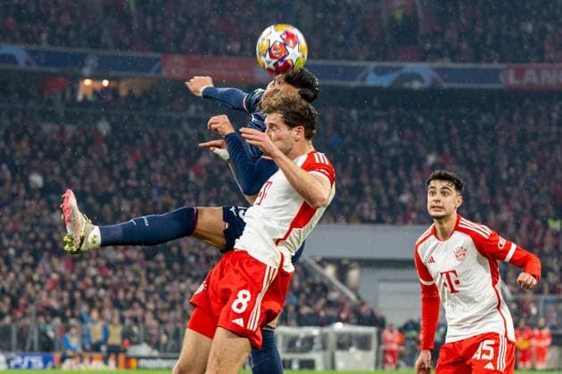 Kopfball Alessio Romagnoli 13 (S.S. Lazio Rom), Leon Goretzka 8 (FC Bayern Muenchen), Aleksandar Pavlovic 45 (FC Bayern Muenchen) beisst die Zaehne zusammen, FC Bayern Muenchen vs. Lazio Rom, Fussball, UEFA Champions League Achtelfinale Rueckspiel, 05.03.2024 DFB regulations prohibit any use of photographs as image sequences and or quasi-video Muenchen Bayern Deutschland