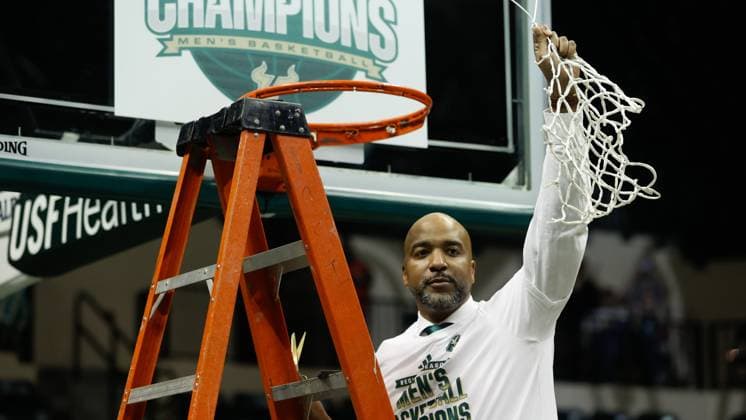March 5, 2024, Florida, USA: South Florida Bulls head coach Amir Abdur-Rahim cuts down a piece of the net and celebrates, after his team defeats the Tulane Green Wave, 85-72, during the end of the game at the Yuengling Center on Tuesday, March 5, 2024, in Tampa. USA - ZUMAs70_ 0419822411st Copyright: xTampaxBayxTimesx