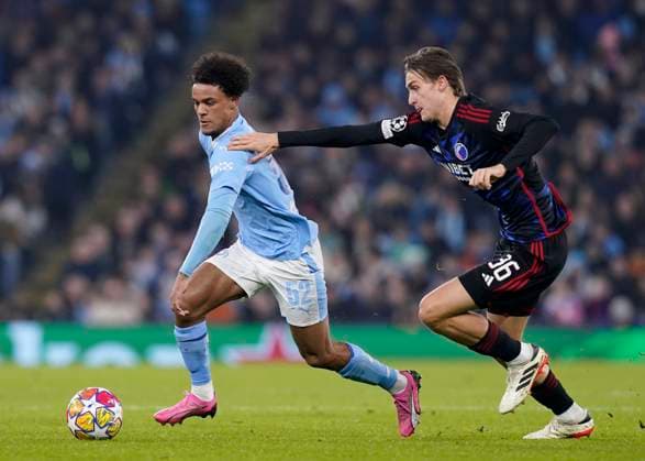 MANCHESTER, ENGLAND, 6th March 2024. Oscar Bobb of Manchester City and William Clem of FC Copenhagen challenge for the ball during the UEFA Champions League match at the Etihad Stadium, MANCHESTER. Picture credit should read: Andrew Yates Sportimage EDITORIAL USE ONLY. No use with unauthorised audio, video, data, fixture lists, club league logos or live services. Online in-match use limited to 120 images, no video emulation. No use in betting, games or single club league player publications. SPI-2988-0043