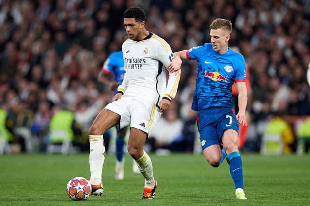 Jude Bellingham of Real Madrid CF (L) in action with Dani Olmo (R) during the UEFA Champions League match between Real Madrid v RB Leipzig at Santiago Bernabeu on March 6, 2024 in Madrid (Photo by: LGM) FOOTBALL : Real Madrid vs RB Leipzig - UEFA Ligue des Champions - 06 03 2024 LGM Panoramic 