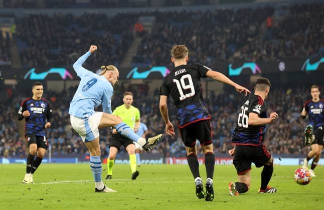 6th March 2024; Etihad Stadium, Manchester, England; Champions League Football, Round of 16, Manchester City versus Copenhagen; Erling Haaland of Manchester City shoots and scores with a left footed shot for 3-1 after 3 added minutes at the end of the first half  ActionPlus12615761 DavidxBlunsden