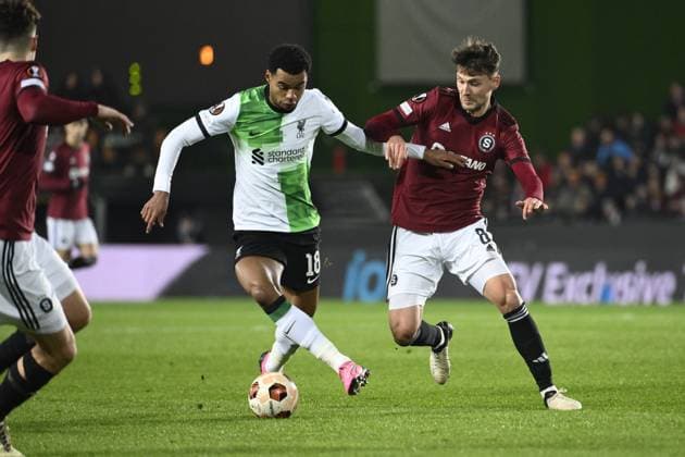 From left Cody Gakpo of Liverpool, Kaan Kairinen of Sparta in action during the Europa League semifinal opening match: Sparta vs Liverpool in Prague, Czech Republic, March 7, 2024. (CTKxPhoto OndrejxDeml) CTKPhotoP2024030708674  CTKPhotoP2024030708674