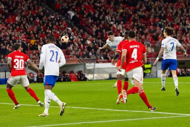 Tom Lawrence of Rangers scores with his head during the Europa League Round of 16 Match at the Estadio da Luz, Lisbon. Benfica v Rangers, UEFA Europa League, Round of 16, First Leg, Football, Estadio da Luz, Lisbon, Portugal - 07 Mar 2024 EDITORIAL USE ONLY No use with unauthorised audio, video, data, fixture lists, club league logos or live services. Online in-match use limited to 120 images, no video emulation. No use in betting, games or single club league player publications. Copyright: xLukexNickerson RangersxFC Shutterstockx 14380036be