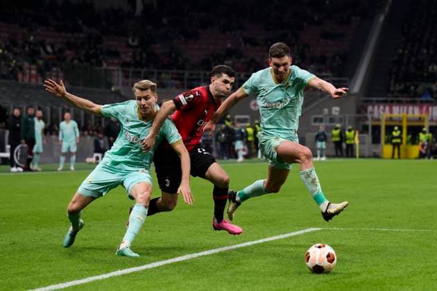 AC Milan v SK Slavia Praha - UEFA Europa League Christian Pulisic of AC Milan competes for the ball with Ondrej Zmrzly and Lukas Provod of SK Slavia Praha during the UEFA Europa League round of 16 first leg football match between AC Milan and SK Slavia Praha. Milan Italy Copyright: xNicolòxCampox