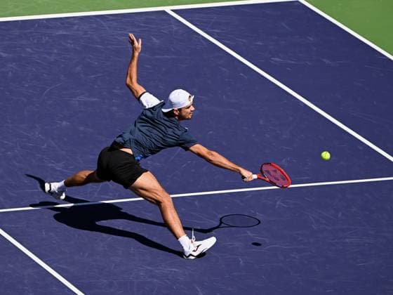 INDIAN WELLS, CA - MARCH 07: Tomas Machac (CZE) chases the ball and hits a return during an ATP, Tennis Herren tennis match played on March 7, 2024 at the BNP Paribas Open at the Indian Wells Tennis Garden in Indian Wells, CA. (Photo by John Cordes Icon Sportswire) TENNIS: MAR 07 BNP Paribas Open EDITORIAL USE ONLY Icon506240307004