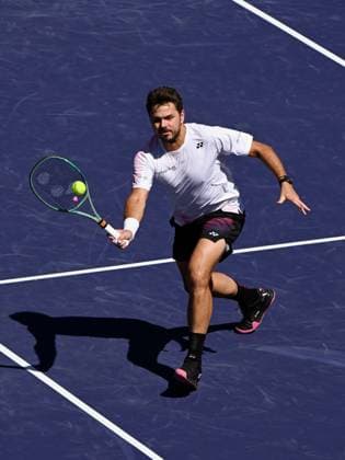 INDIAN WELLS, CA - MARCH 07: Stan Wawrinka (SUI) returns the ball during an ATP, Tennis Herren tennis match played on March 7, 2024 at the BNP Paribas Open at the Indian Wells Tennis Garden in Indian Wells, CA. (Photo by John Cordes Icon Sportswire) TENNIS: MAR 07 BNP Paribas Open EDITORIAL USE ONLY Icon506240307009
