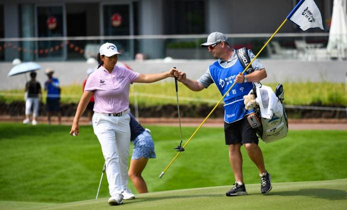 (240308) -- LINGSHUI, March 8, 2024 -- Yin Ruoning (L) of China pumps fists with her caddie during the second round of the Blue Bay LPGA, Golf Damen golf tournament in Lingshui, south China s Hainan Province, March 8, 2024. ) (SP)CHINA-HAINAN-LINGSHUI-GOLF-BLUE BAY LPGA (CN) YangxGuanyu 