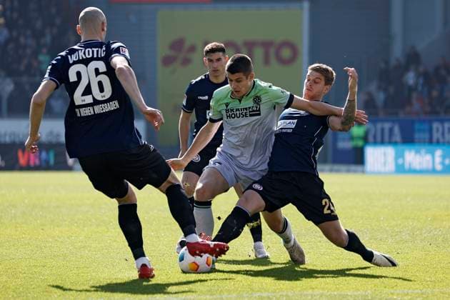 09.03.2024, xavx, Fussball 2.Bundesliga, SV Wehen Wiesbaden - Hannover 96 emspor, v.l. Aleksandar Vukotic (SV Wehen Wiesbaden), Robin Heußer (SV Wehen Wiesbaden), NicolÃ² Tresoldi (Hannover 96), Marcus Mathisen (SV Wehen Wiesbaden) (DFL DFB REGULATIONS PROHIBIT ANY USE OF PHOTOGRAPHS as IMAGE SEQUENCES and or QUASI-VIDEO) Wiesbaden