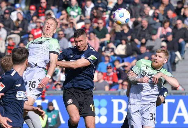 09.03.2024, xblx, Fussball 2.Bundesliga, SV Wehen Wiesbaden - Hannover 96 emspor, v.l. Havard Nielsen (Hannover 96), Ivan Prtajin (SV Wehen Wiesbaden), Andreas Voglsammer (Hannover 96) (DFL DFB REGULATIONS PROHIBIT ANY USE OF PHOTOGRAPHS as IMAGE SEQUENCES and or QUASI-VIDEO) Wiesbaden