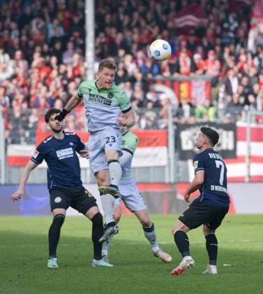 09.03.2024, xblx, Fussball 2.Bundesliga, SV Wehen Wiesbaden - Hannover 96 emspor, v.l. Nikolas Agrafiotis (SV Wehen Wiesbaden), Marcel Halstenberg (Hannover 96), Robin Heußer Heusser (SV Wehen Wiesbaden) (DFL DFB REGULATIONS PROHIBIT ANY USE OF PHOTOGRAPHS as IMAGE SEQUENCES and or QUASI-VIDEO) Wiesbaden