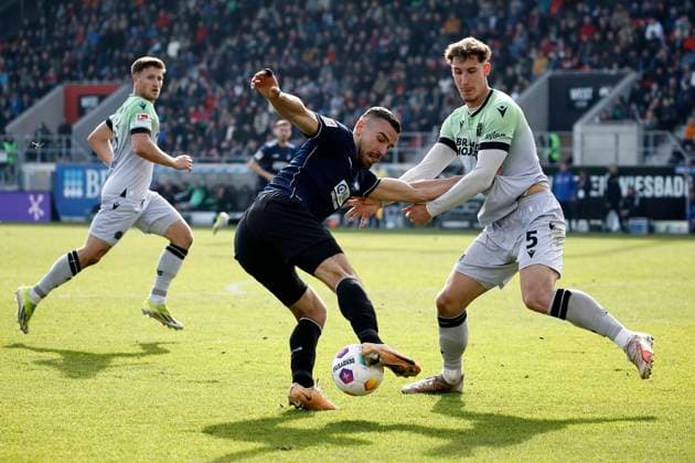 09.03.2024, xavx, Fussball 2.Bundesliga, SV Wehen Wiesbaden - Hannover 96 emspor, v.l. Enzo Leopold (Hannover 96), Ivan Prtajin (SV Wehen Wiesbaden), Phil Neumann (Hannover 96) (DFL DFB REGULATIONS PROHIBIT ANY USE OF PHOTOGRAPHS as IMAGE SEQUENCES and or QUASI-VIDEO) Wiesbaden