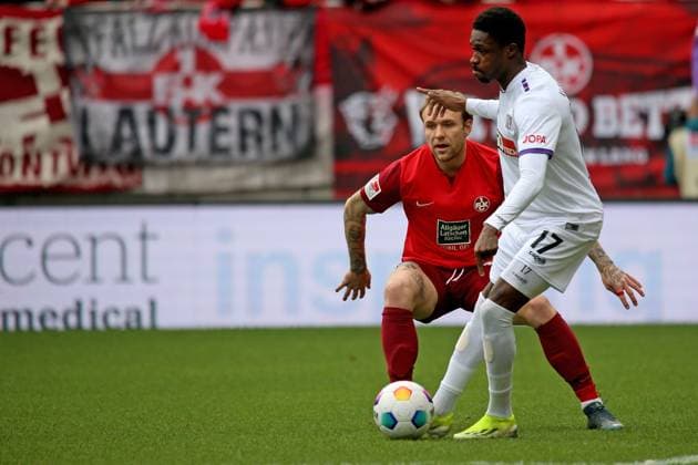 10.03.2024, xmohx, Fussball 2.Bundesliga, 1.FC Kaiserslautern - VfL Osnabrück emspor, v.l. Tymoteusz Puchacz (1. FC Kaiserslautern) Christian Conteh (VfL Osnabrueck Osnabrück) Zweikampf, Aktion, action, battle for the ball (DFL DFB REGULATIONS PROHIBIT ANY USE OF PHOTOGRAPHS as IMAGE SEQUENCES and or QUASI-VIDEO) Kaiserslautern