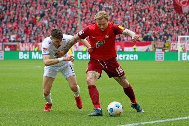 10.03.2024, xmohx, Fussball 2.Bundesliga, 1.FC Kaiserslautern - VfL Osnabrück emspor, v.l. Charalampos Makridis (VfL Osnabrueck Osnabrück) Tymoteusz Puchacz (1. FC Kaiserslautern) Zweikampf, Aktion, action, battle for the ball (DFL DFB REGULATIONS PROHIBIT ANY USE OF PHOTOGRAPHS as IMAGE SEQUENCES and or QUASI-VIDEO) Kaiserslautern