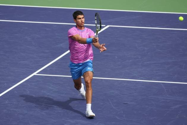 INDIAN WELLS, CA - MARCH 10: Carlos Alcaraz (ESP) hits a forehand during the BNP Paribas Open on March 10, 2024 at Indian Wells Tennis Garden in Indian Wells, CA. (Photo by George Walker Icon Sportswire) TENNIS: MAR 10 BNP Paribas Open EDITORIAL USE ONLY Icon240310083