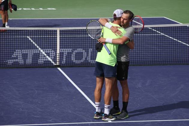 INDIAN WELLS, CA - MARCH 10: Tommy Paul (USA) embraces doubles partner Steve Johnson (USA) after their final match of the BNP Paribas Open on March 10, 2024 at Indian Wells Tennis Garden in Indian Wells, CA. (Photo by George Walker Icon Sportswire) TENNIS: MAR 10 BNP Paribas Open EDITORIAL USE ONLY Icon240310109