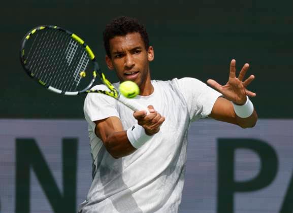 March 10, 2024 Felix Auger-Aliassime of Canada returns a shot against Carlos Alcaraz of Spain during the BNP Paribas Open in Indian Wells, CA. CSM Indian Wells United States of America - ZUMAc04_ 20240310_zma_c04_226 Copyright: xCharlesxBausx