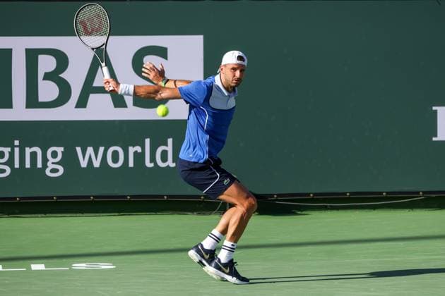 INDIAN WELLS, CA - MARCH 11: Grigor Dimitrov (BUL) hits a backhand during the BNP Paribas Open on March 11, 2024 at Indian Wells Tennis Garden in Indian Wells, CA. (Photo by George Walker Icon Sportswire) TENNIS: MAR 11 BNP Paribas Open EDITORIAL USE ONLY Icon240311142
