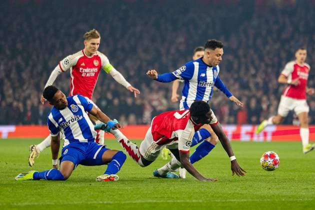 Arsenal v FC Porto Champions League 12 03 2024. Round of 16 Galeno (13) of FC Porto brings down Bukayo Saka (7) of Arsenal during the Champions League match between Arsenal and FC Porto at the Emirates Stadium, London, England on 12 March 2024. Editorial use only , Copyright: xNigelxKeenex PSI-19227-0004