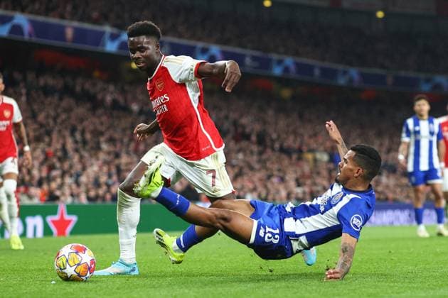 Arsenal v Porto 12 March 2024, London - UEFA Champion™s League, Round of Sixteen, Second Leg - Arsenal v Porto - Bukayo Saka of Arsenal and Galeno of Porto - Photo: Charlotte Wilson Offside. London UK Copyright: xCharlottexWilsonx xOffsidexOffside