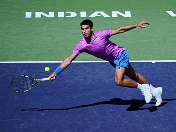 INDIAN WELLS, CA - MARCH 12: Carlos Alcaraz (ESP) chases after and returns the ball during an ATP, Tennis Herren tennis match played on March 12, 2024 during the BNP Paribas Open played at the Indian Wells Tennis Garden in Indian Wells, CA. (Photo by John Cordes Icon Sportswire) TENNIS: MAR 12 BNP Paribas Open EDITORIAL USE ONLY Icon506240312120