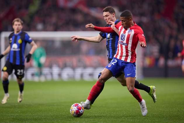 Samuel Lino (Atletico de Madrid) and Benjamin Pavard (FC Internazionale) battle for the ball, UEFA Champions League 2023 24 - Round of 16 Second Leg, Atletico de Madrid vs Inter Milan, Civitas Metropolitano, March 13, 2024, Madrid, ESP.