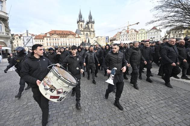 Police officers supervise fans gathering before the march to the match Slavia Praha vs AC Milan, the return match of the Europa League semi-final football match, on March 14, 2024, in Old Town Square, Prague, Czech Republic. (CTKxPhoto VitxSimanek) CTKPhotoP2024031406247  CTKPhotoP2024031406247
