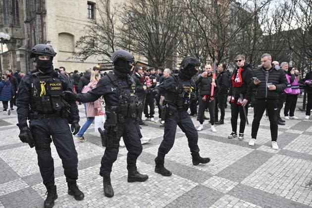 Police officers supervise fans gathering before the march to the match Slavia Praha vs AC Milan, the return match of the Europa League semi-final football match, on March 14, 2024, in Old Town Square, Prague, Czech Republic. (CTKxPhoto VitxSimanek) CTKPhotoP2024031406067  CTKPhotoP2024031406067