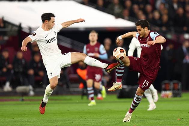 Konstantinos Mavropanos of West Ham United and Nicolas Hofler of SC Freiburg battle for the ball West Ham United v Freiburg, UEFA Europa League, Round of 16, Second Leg, Football, London Stadium, London, UK - 14 Mar 2024 EDITORIAL USE ONLY No use with unauthorised audio, video, data, fixture lists, club league logos or live services. Online in-match use limited to 120 images, no video emulation. No use in betting, games or single club league player publications. Copyright: xSimonxDael Shutterstockx 14385551g