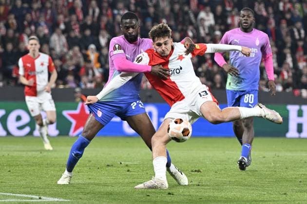 Fikayo Tomori of AC Milan, left, and Mojmir Chytil of Slavia in action during the Slavia Praha vs AC Milan football return match of the Europa League semi-final on March 14, 2024, Prague, Czech Republic. (CTKxPhoto KaterinaxSulova) CTKPhotoP2024031407251  CTKPhotoP2024031407251