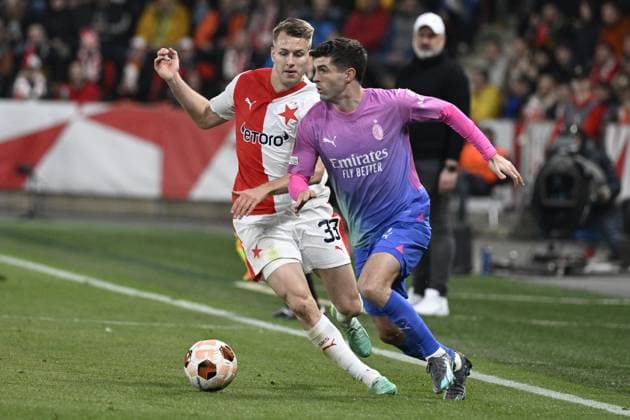 Ondrej Zmrzly of Slavia, left, and Christian Pulisic of AC Milan in action during the Slavia Praha vs AC Milan football return match of the Europa League semi-final on March 14, 2024, Prague, Czech Republic. (CTKxPhoto KaterinaxSulova) CTKPhotoP2024031407279  CTKPhotoP2024031407279