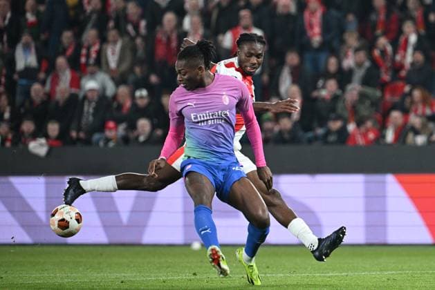Rafael Leao of AC Milan, left, and Igoh Ogbu of Slavia in action during the Slavia Praha vs AC Milan football return match of the Europa League semi-final on March 14, 2024, Prague, Czech Republic. (CTKxPhoto MichalxKamaryt) CTKPhotoP2024031407375  CTKPhotoP2024031407375