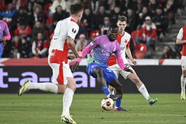 Yunus Musah of AC Milan, left, and David Doudera of Slavia in action during the Slavia Praha vs AC Milan football return match of the Europa League semi-final on March 14, 2024, Prague, Czech Republic. (CTKxPhoto KaterinaxSulova) CTKPhotoP2024031407432  CTKPhotoP2024031407432
