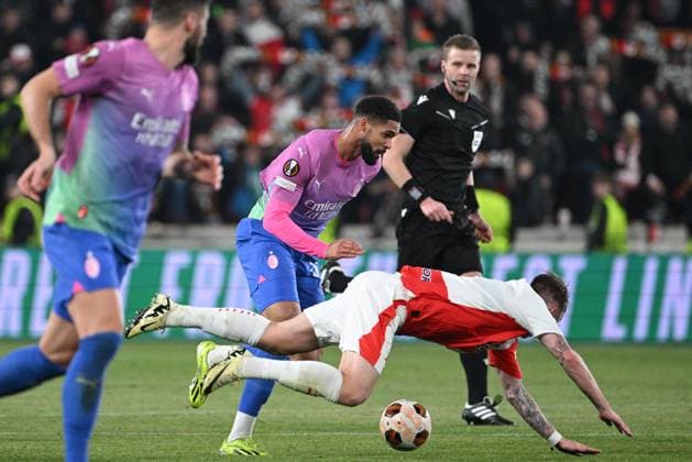 Ruben Loftus-Cheek of AC Milan, left, and Conrad Wallem of Slavia Praha in action during the Slavia Praha vs AC Milan football return match of the Europa League semi-final on March 14, 2024, Prague, Czech Republic. (CTKxPhoto MichalxKamaryt) CTKPhotoP2024031407593  CTKPhotoP2024031407593
