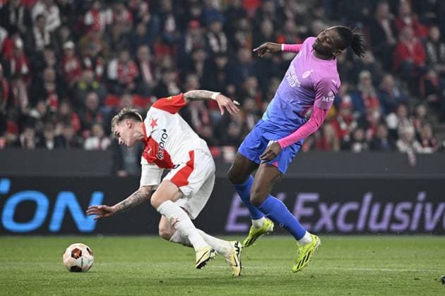Conrad Wallem of Slavia Praha, left, and Rafael Leao of AC Milan in action during the Slavia Praha vs AC Milan football return match of the Europa League semi-final on March 14, 2024, Prague, Czech Republic. (CTKxPhoto KaterinaxSulova) CTKPhotoP2024031407842  CTKPhotoP2024031407842