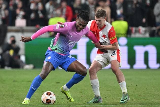 Rafael Leao of AC Milan, left, and David Doudera of Slavia Praha in action during the Slavia Praha vs AC Milan football return match of the Europa League semi-final on March 14, 2024, Prague, Czech Republic. (CTKxPhoto MichalxKamaryt) CTKPhotoP2024031407971  CTKPhotoP2024031407971