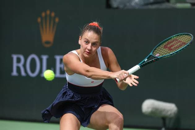 INDIAN WELLS, CA - MARCH 14: Marta Kostyuk (UKR) hits a backhand during the BNP Paribas Open on March 14, 2024 at Indian Wells Tennis Garden in Indian Wells, CA. (Photo by George Walker Icon Sportswire) TENNIS: MAR 14 BNP Paribas Open EDITORIAL USE ONLY Icon240314021