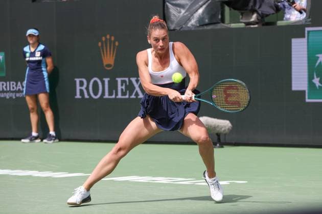 INDIAN WELLS, CA - MARCH 14: Marta Kostyuk (UKR) hits a backhand during the BNP Paribas Open on March 14, 2024 at Indian Wells Tennis Garden in Indian Wells, CA. (Photo by George Walker Icon Sportswire) TENNIS: MAR 14 BNP Paribas Open EDITORIAL USE ONLY Icon240314034