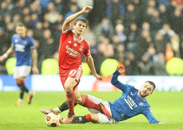 Rangers v Benfica UEFA Europa League Jo?o Neves of Benfica (left) is tackled by Nicolas Raskin of Rangers during the UEFA Europa League Round of 16 Second Leg match at Ibrox Stadium, Glasgow Copyright: xFredxPalmerx FIL-19834-0082 UK Newspapers OUT