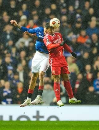 Connor Goldson of Rangers & Alvaro Carreras of Benfica challenge for the ball. Rangers v Benfica, UEFA Europa League, Round of 16, Second Leg, Football, Ibrox Stadium, Glasgow, UK - 14 Mar 2024 EDITORIAL USE ONLY No use with unauthorised audio, video, data, fixture lists, club league logos or live services. Online in-match use limited to 120 images, no video emulation. No use in betting, games or single club league player publications. Copyright: xStuartxWallace Shutterstockx 14385550af