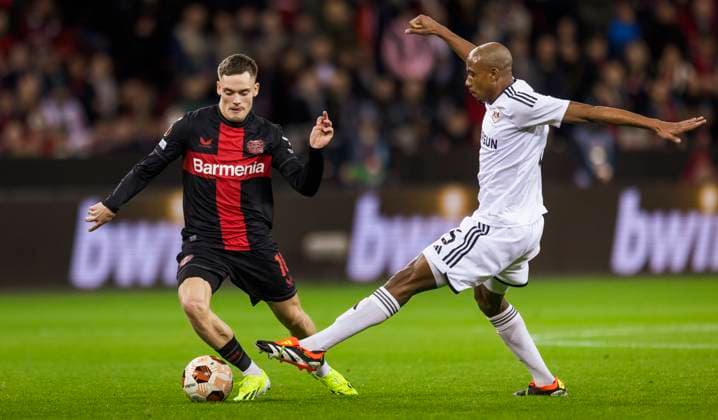 Leverkusen, Germany. 14th Mar 2024. Florian Wirtz (Leverkusen) Julio Romao (Qarabag) Bayer Leverkusen - Qarabag Agdam 14.03.2024