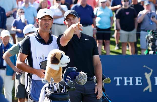 PONTE VEDRA BEACH, FL - MARCH 14: PGA, Golf Herren golfer Rory McIlroy talks to his caddie about where his tee shot on the 18th hole went in the water during The Players Championship on March 14, 2024, at TPC Sawgrass in Ponte Vedra Beach, Florida. (Photo by Brian Spurlock Icon Sportswire) GOLF: MAR 14 PGA THE PLAYERS Championship EDITORIAL USE ONLY Icon24031430