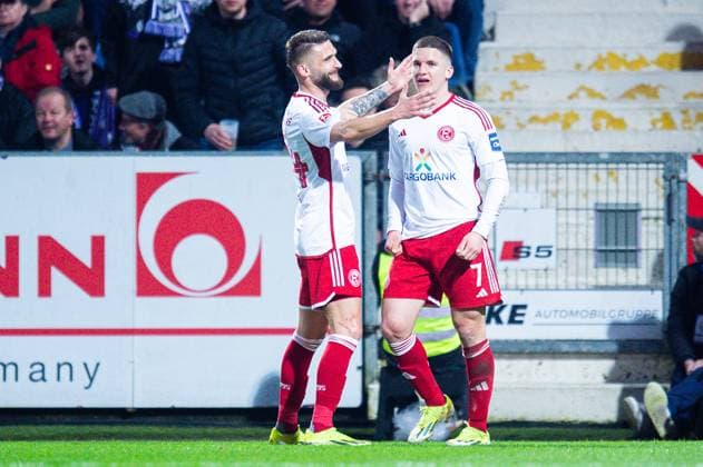 15.03.2024 - Fußball, 2023 2024, 2. Bundesliga, 26. Spieltag, VfL Osnabrück - Fortuna Düsseldorf: (R) Christos Tzolis (Düsseldorf) jubelt nach seinem Tor zum 0:1 mit (L) Nicolas Gavory (Düsseldorf) DFL REGULATIONS PROHIBIT ANY USE OF PHOTOGRAPHS AS IMAGE SEQUENCES AND OR QUASI-VIDEO.